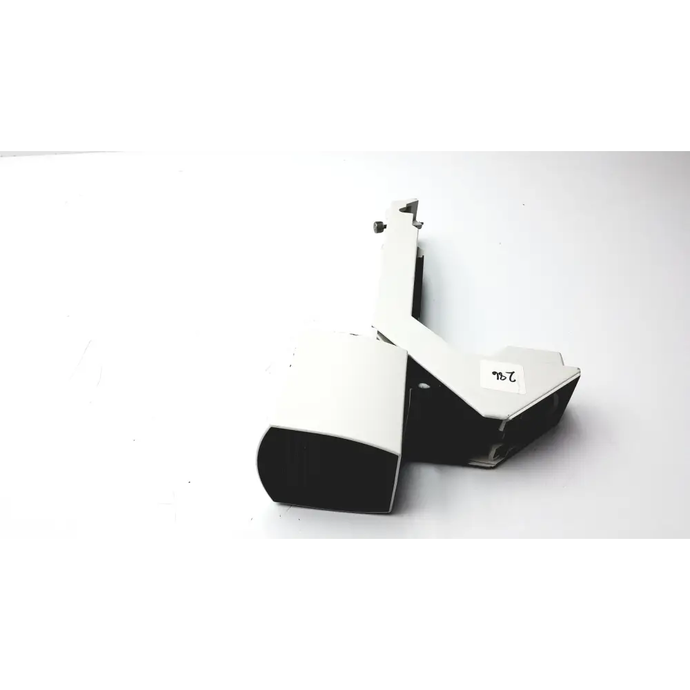 White and black plastic camera housing with a small label reading ’7b’ on its side