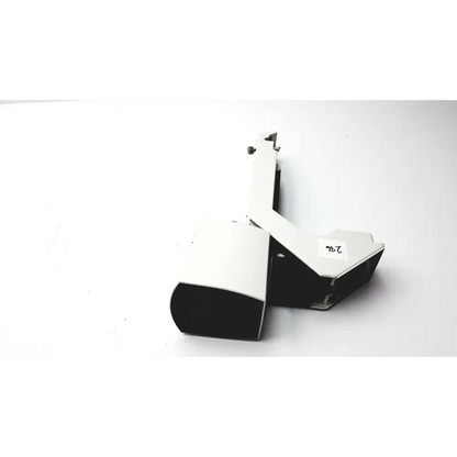 White and black plastic camera housing with a small label reading ’7b’ on its side