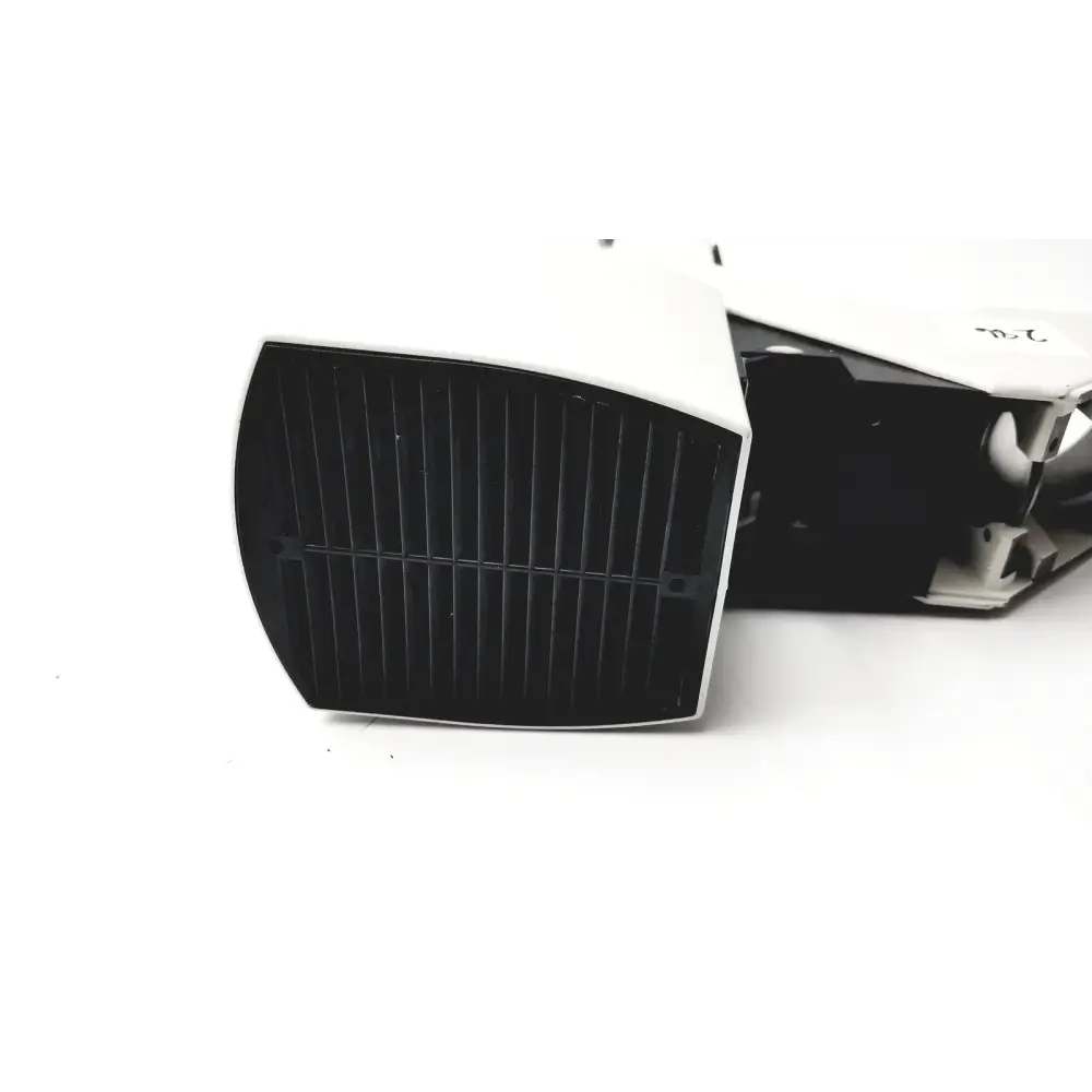 White plastic device with black gridded front panel