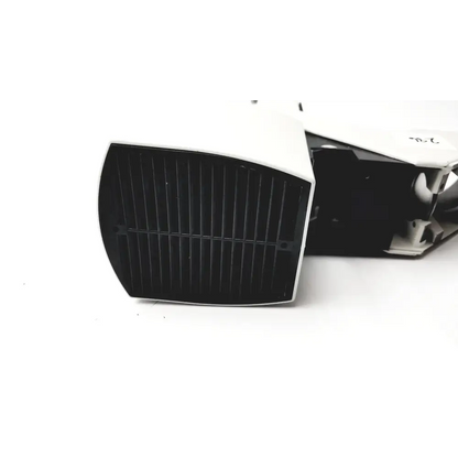 White plastic device with black gridded front panel