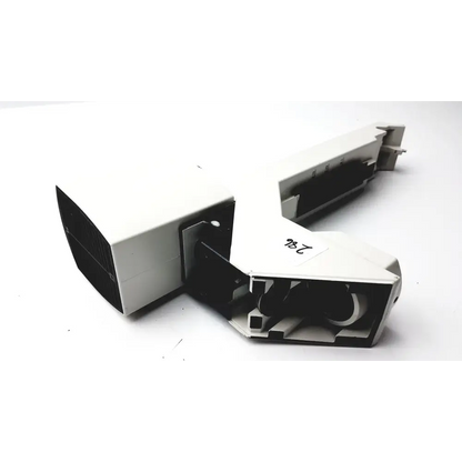 White plastic camera housing with black internal components and a visible label marked ’246’’