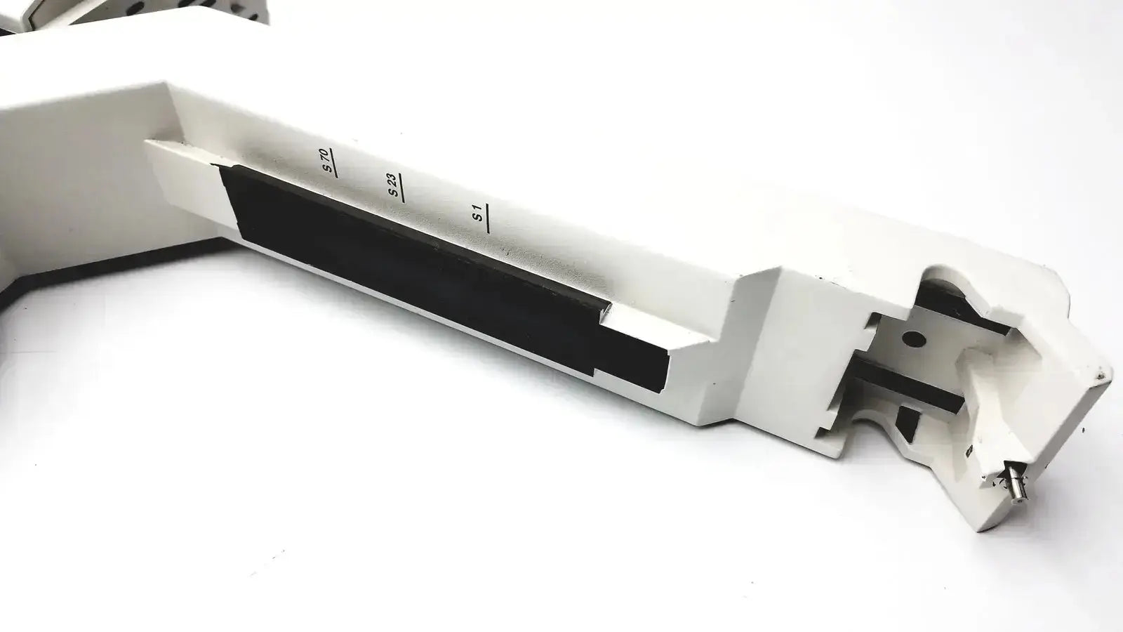 White metal lathe tool holder with black insert and engraved measurements for Leica DM IRB 12v 100w halogen lamp housing