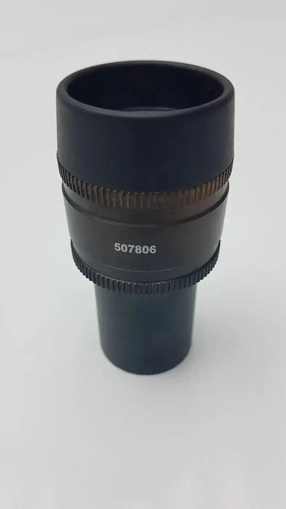 Black cylindrical leica hc plan microscope eyepiece with textured focus rings and engraved serial number 507806 hospital surplus