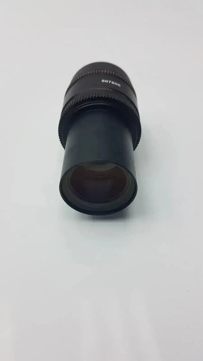 Black cylindrical leica hc plan microscope eyepiece with textured focus ring and engraved serial number from hospital surplus