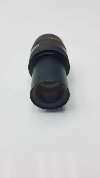 Black cylindrical leica hc plan microscope eyepiece with textured focus ring and metallic accents for hospital surplus use