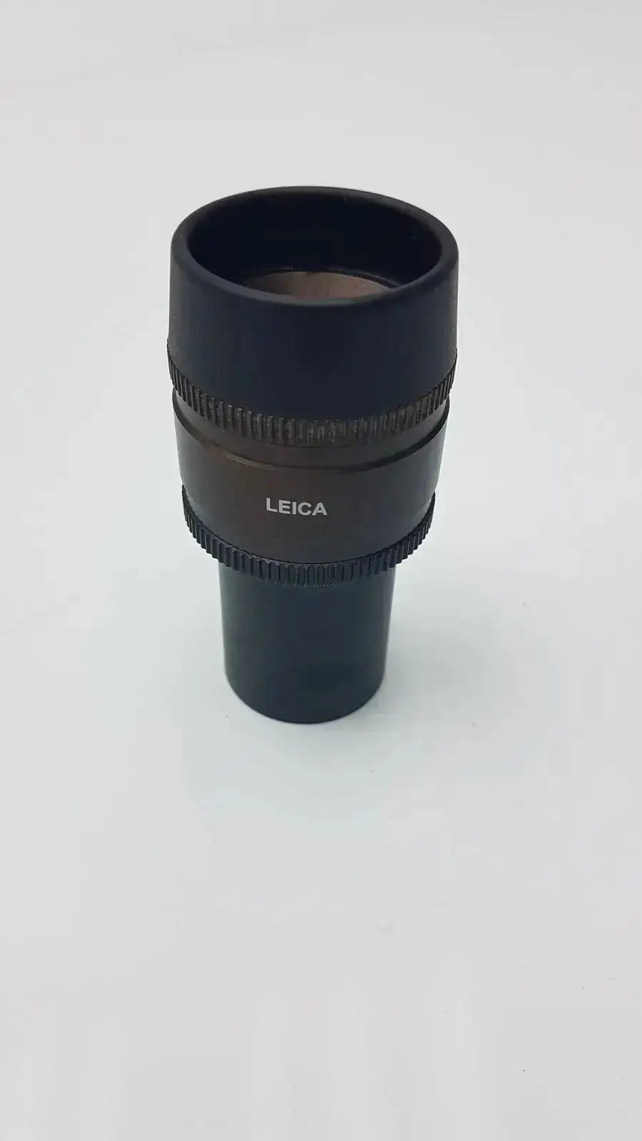 Black Leica HC Plan S 10x 22 M microscope eyepiece with textured rings and matte finish for hospital surplus use
