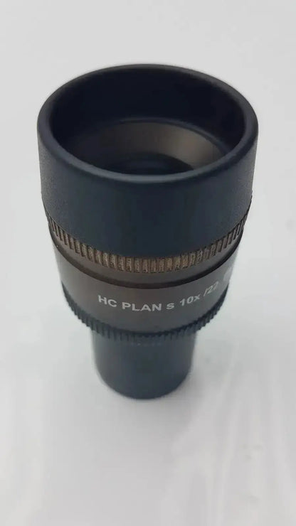 Black Leica HC Plan microscope eyepiece with 10x magnification and textured focus ring from hospital surplus