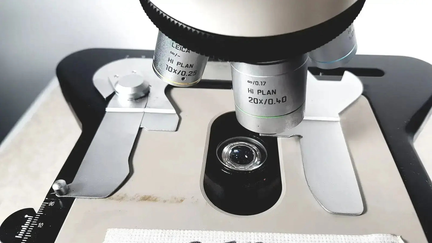 Leica microscope model dm1000 hi plan 20x objective lens with silver metallic body and black accents for precise imaging