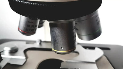 Black and silver microscope objective lenses with engraved markings for leica microscope model dm1000 heads
