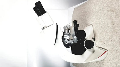 Leica dm1000 white and black compound microscope with silver metallic parts labeled willys buy used medical equipment for sale