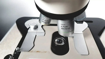 Leica dm1000 microscope with silver and black hi plan 10x 025 and 20x 040 objective lenses pre owned medical equipment for sale