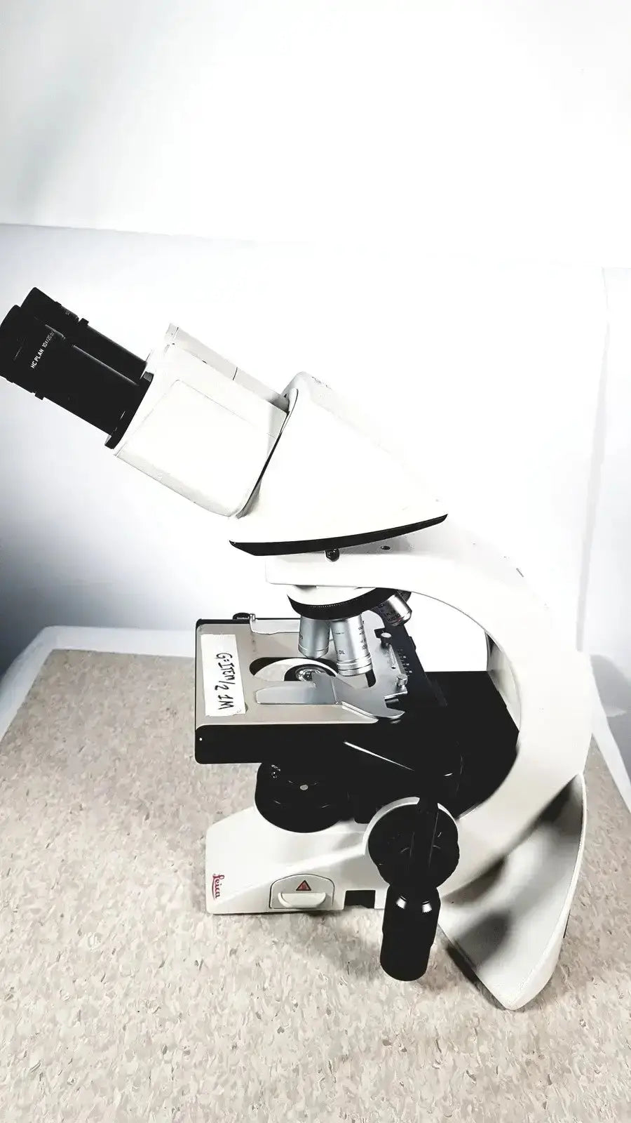 White and black leica dm1000 compound microscope with sleek modern design for used medical equipment for sale