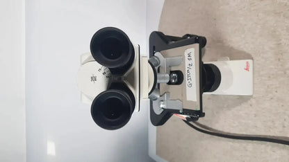 Leica dm1000 binocular microscope with black eyepieces and white body for pre owned medical equipment sale