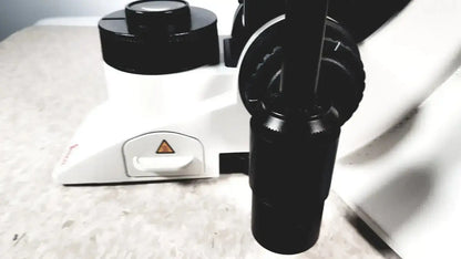 Leica dm1000 black and white compound microscope with black objective lenses and warning triangle base for medical use buy used medical equipment