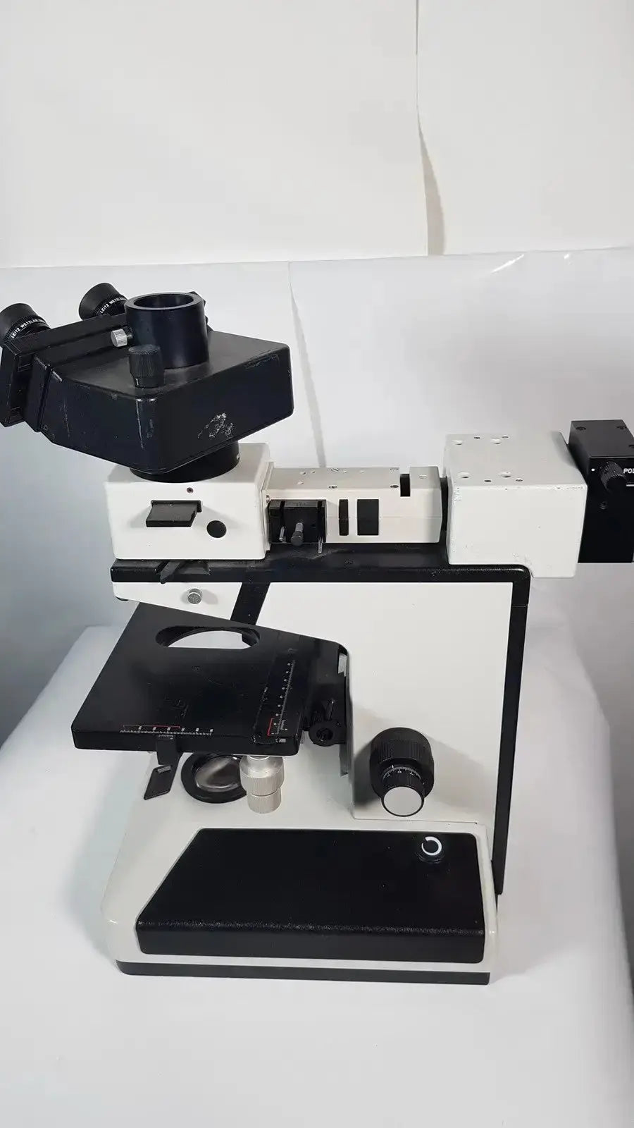 Black and white leitz metallux 3 stereo zoom microscope with dual eyepieces and adjustable stage for precision work