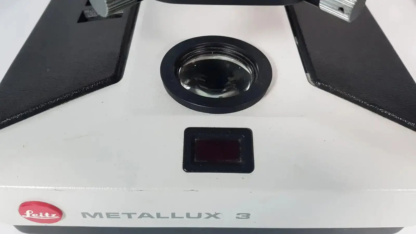 White leitz metallux 3 stereo zoom microscope with black accents and circular lens cover for precision viewing