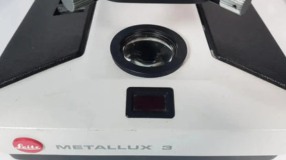 White leitz metallux 3 stereo zoom microscope with black accents and circular lens cover for precision viewing