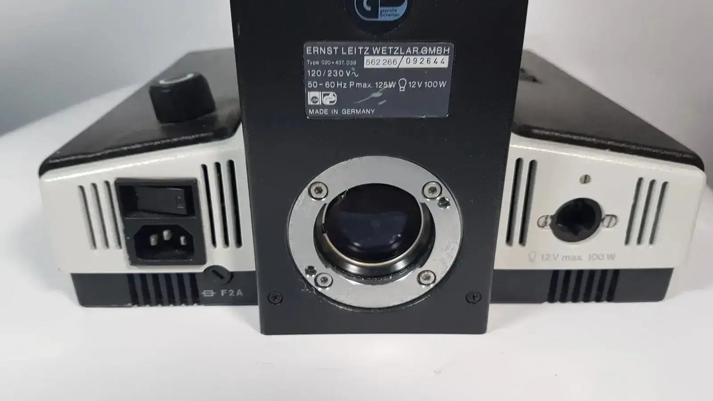 Black and silver ernst leitz wetzlar gmbh laser power supply unit with circular lens port for leitz metallux 3 stereo zoom microscope
