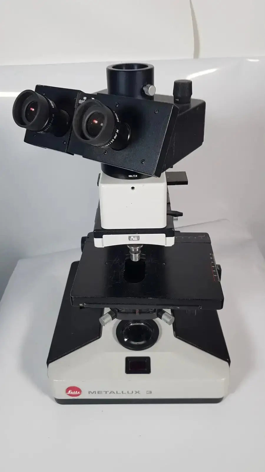 Leitz metallux 3 stereo zoom microscope in black and white metal with dual eyepieces for enhanced viewing