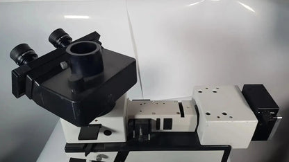 Leitz Metallux 3 stereo zoom microscope in black and white with dual eyepieces and adjustable stage for precise viewing