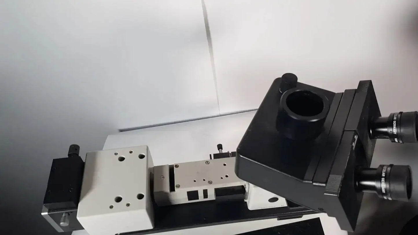 Black and white leitz metallux 3 stereo zoom microscope with dual eyepieces and adjustable stage for precise viewing