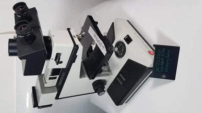Leitz Metallux 3 stereo zoom microscope white and black with dual eyepieces and adjustable focus knobs for precision use