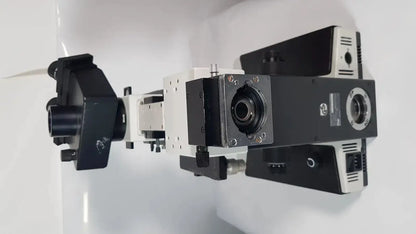 Black and white Leitz Metallux 3 stereo zoom microscope with robust modular design and multiple lenses and adjustment knobs