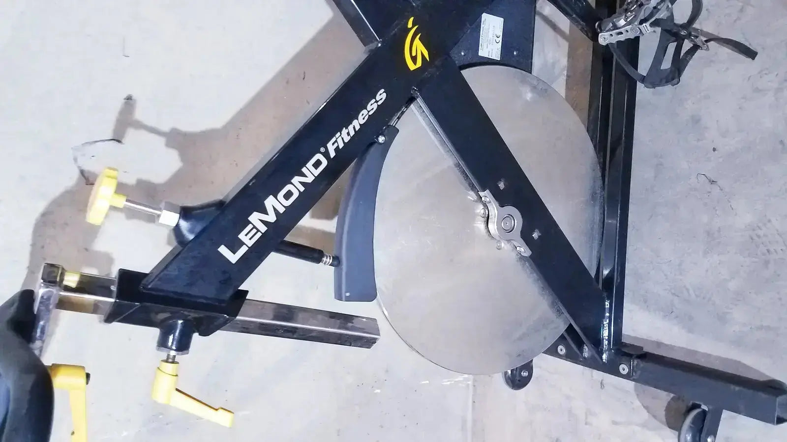 Lemond fitness revmaster sport cycling bike in black with silver flywheel and yellow handlebar adjustments model 15700-3