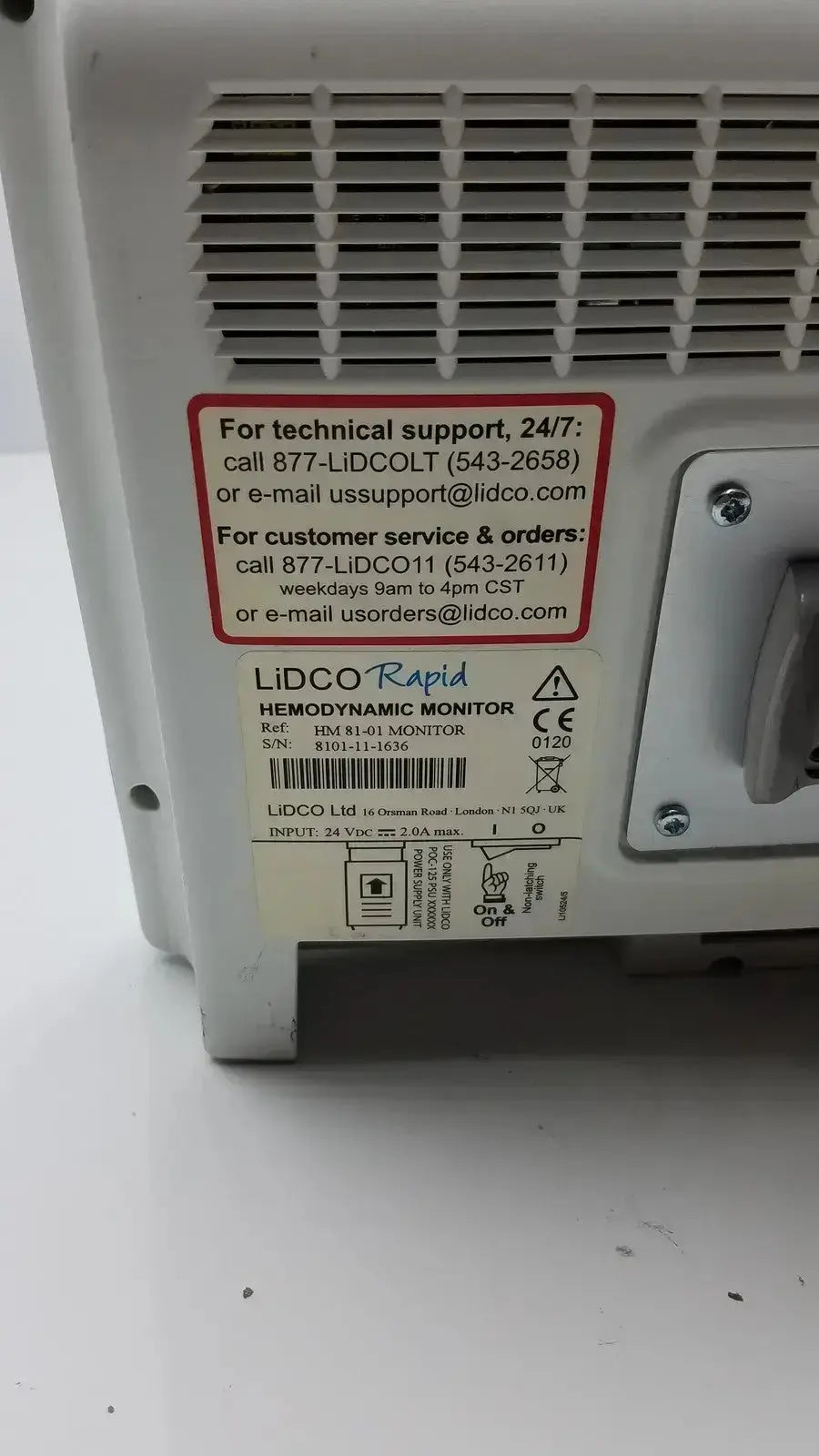 White plastic lidco rapid hm81-01 hemodynamic monitor back panel with vented design and labeled technical specifications