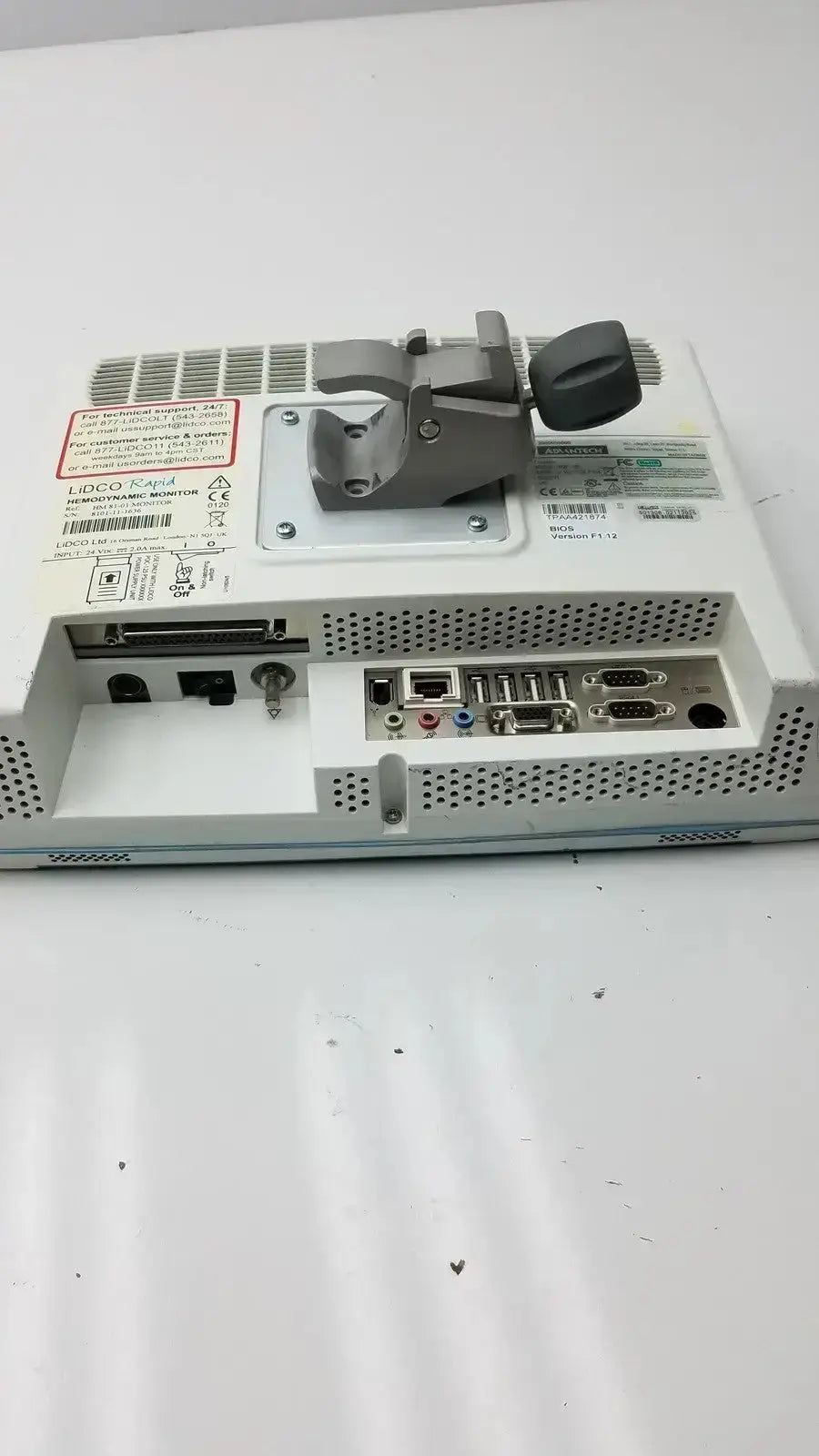 Back view of white lidco rapid hm81-01 hemodynamic monitor with gray mounting bracket and multiple ports