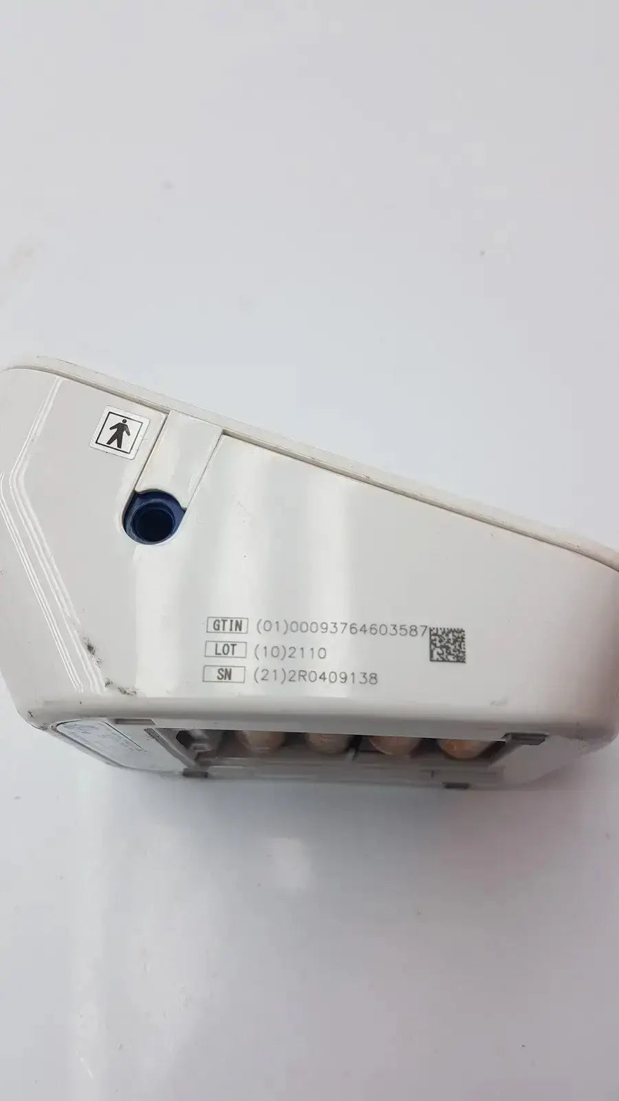 White plastic receipt printer with blue circular port and labels for life source a&d medical digital blood pressure monitor ua-652l-ac
