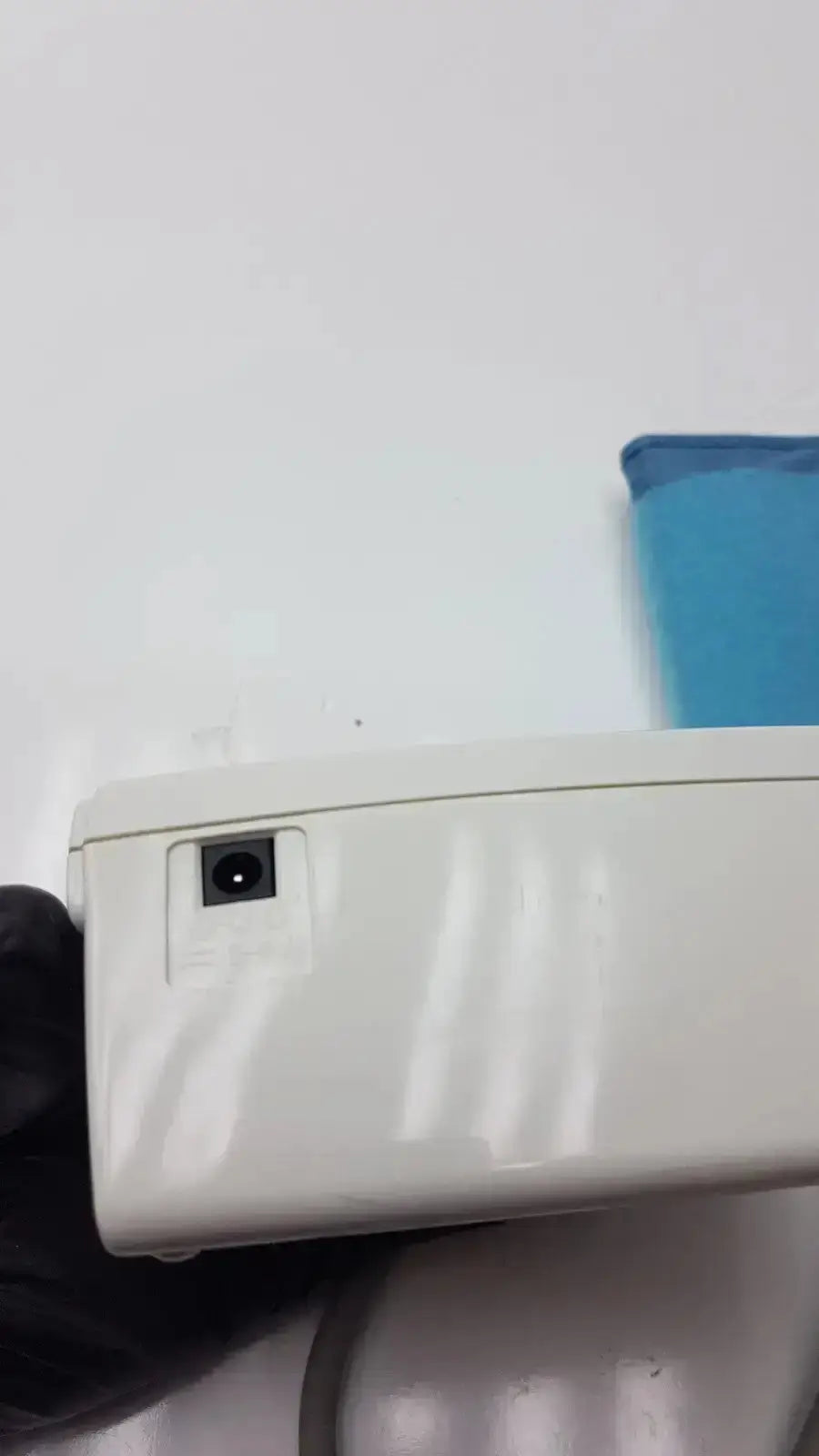White plastic life source model ua-767 plus digital blood pressure monitor showing rectangular power port on side