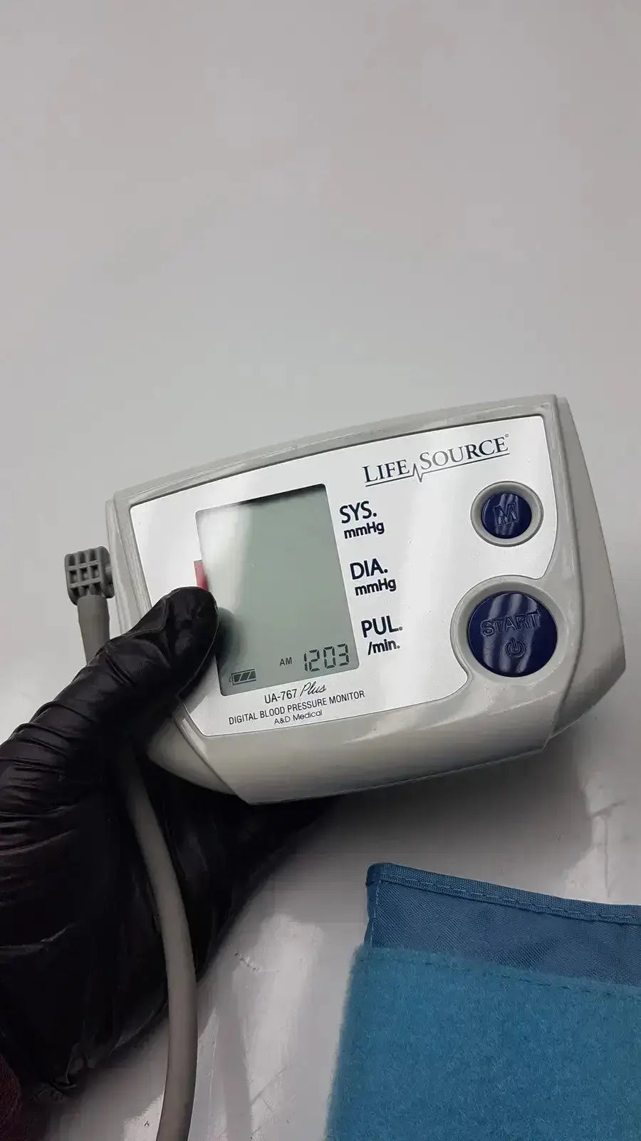 Life source ua-767 plus digital blood pressure monitor with white body, gray cuff, and blue buttons for home use