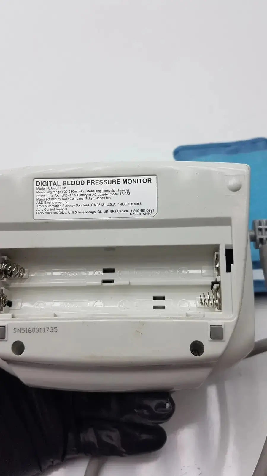 White plastic life source ua-767 plus digital blood pressure monitor showing model specifications label on back panel