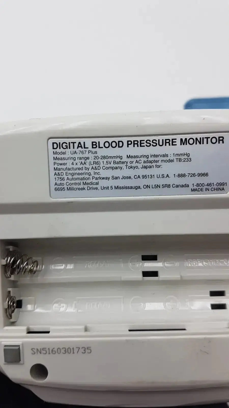 White plastic life source ua-767 plus digital blood pressure monitor with model and specification label visible
