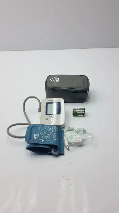 Silver LifeSource A&D Medical digital blood pressure monitor with blue inflatable cuff gray tubing and black carrying case