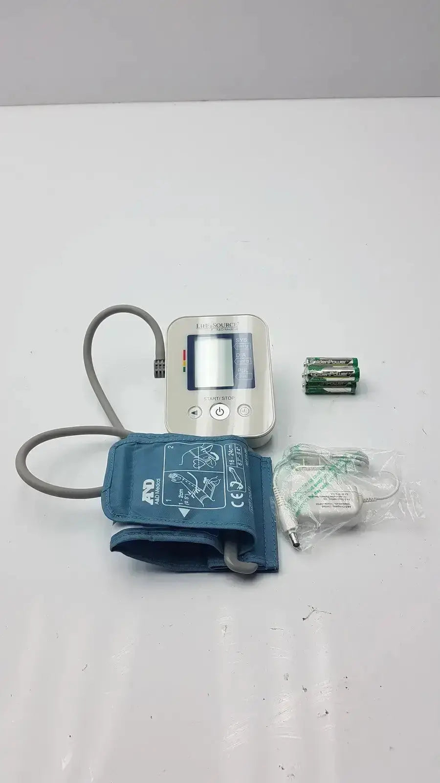 Silver LifeSource A&D Medical digital blood pressure monitor with blue inflatable cuff and gray tubing for medical use