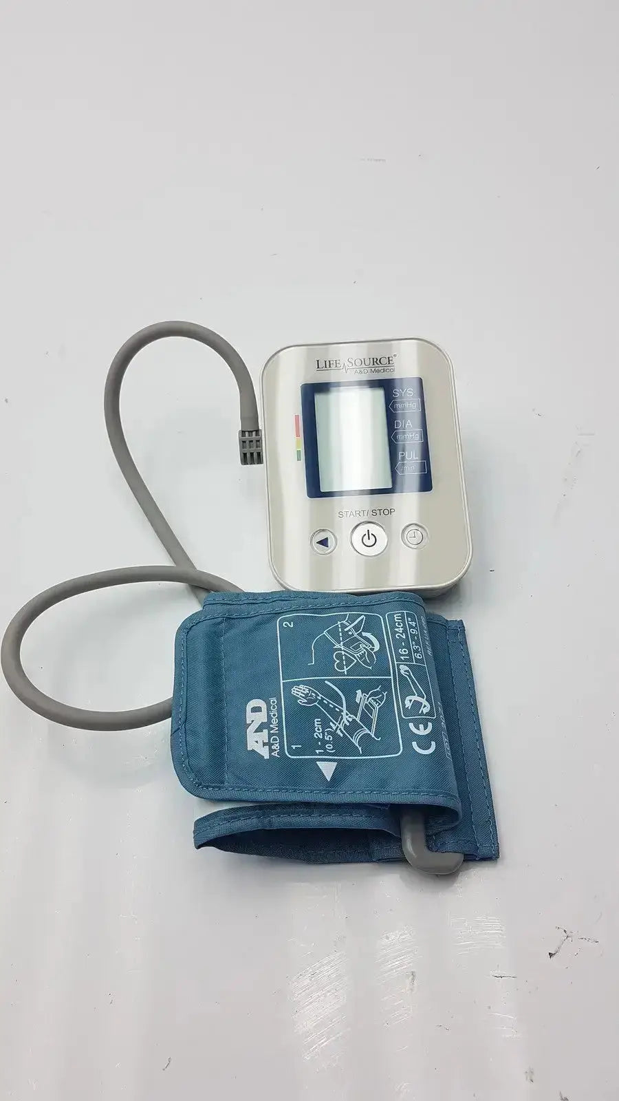 LifeSource A&D Medical digital blood pressure monitor UA-651S-AC with silver body, blue fabric cuff, and gray tubing