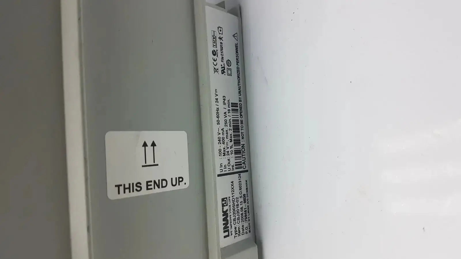 Gray rectangular control box power supply unit with white label and barcode for linak cbj linak cbj2005hd112xx4 back side