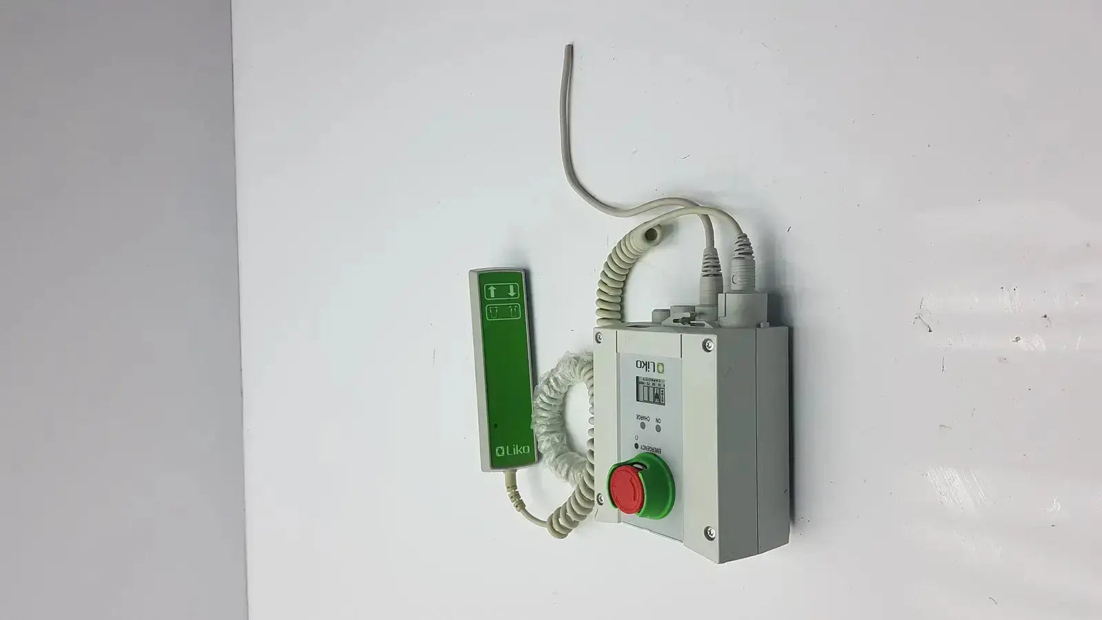 Gray industrial control box with red emergency stop and green push-button coiled to green handset linak cbj2005hd112xx4
