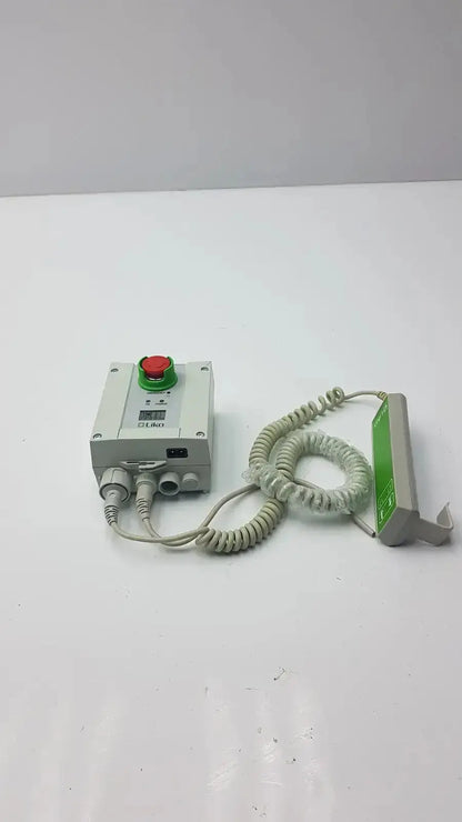 Gray industrial control box with red push button and coiled cable connected to green sensor linak cbj2005hd112xx4