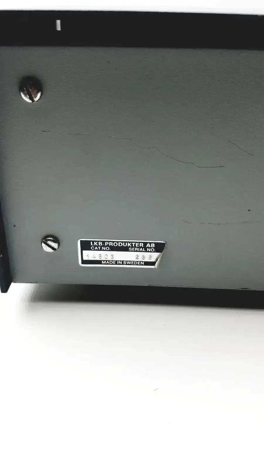 Gray metal lkb cryokit control unit with black label displaying serial no 288 and cat no 14803 secured by silver screws