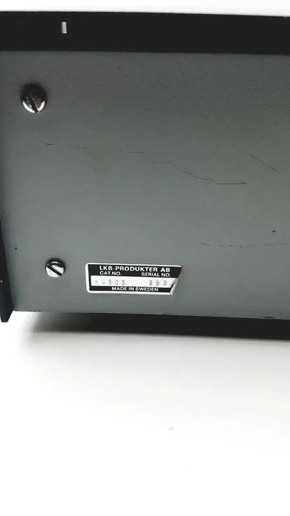 Gray metal lkb cryokit control unit with black label displaying serial no 288 and cat no 14803 secured by silver screws