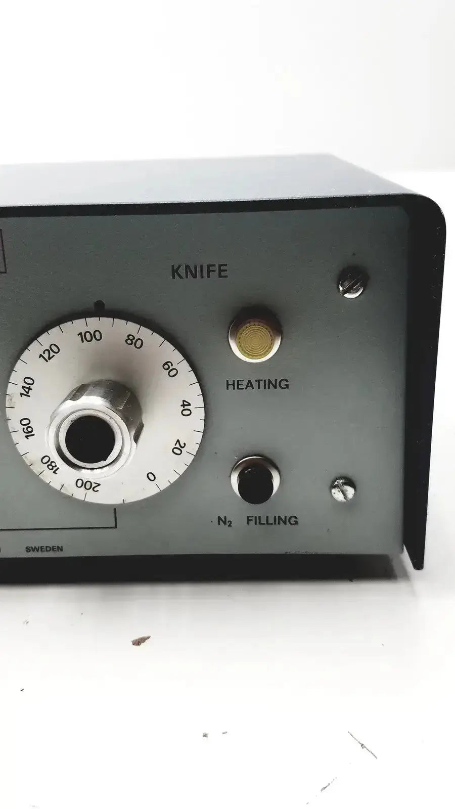 Gray metal industrial knife cutting machine with circular dial and brass heating port in lkb cryokit control unit sweden