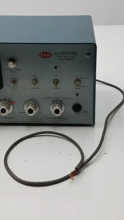 Gray metal lkb ultrotome control unit type 4822a with multiple knobs and ports for precise sample sectioning
