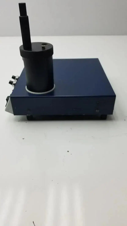 Dark blue rectangular lkb wallac 1250 luminometer with black cylindrical component for biomedical technicians hospital surplus