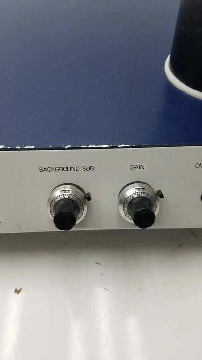 Silver control knobs with black centers labeled background sub and gain on lkb wallac 1250 luminometer panel for biomedical technicians