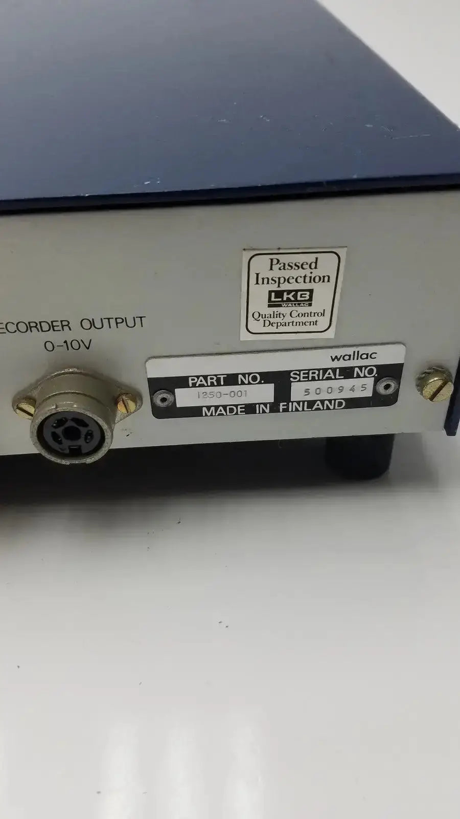 Silver and black lkb wallac 1250 luminometer back side with matte finish and circular recorder output port 0-10v for hospital surplus