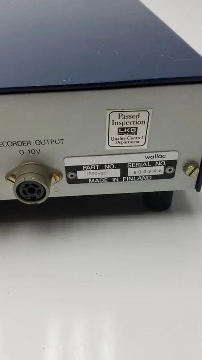 Silver and black lkb wallac 1250 luminometer back side with matte finish and circular recorder output port 0-10v for hospital surplus
