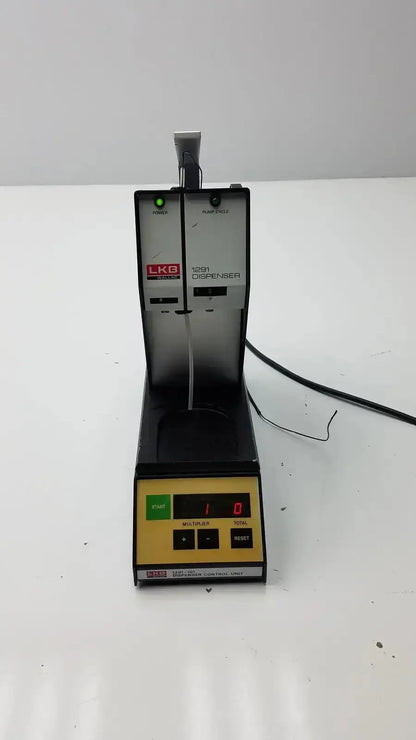 Black and yellow lkb wallac 1291 reagent dispenser with digital display and control buttons for vitro diagnostic use